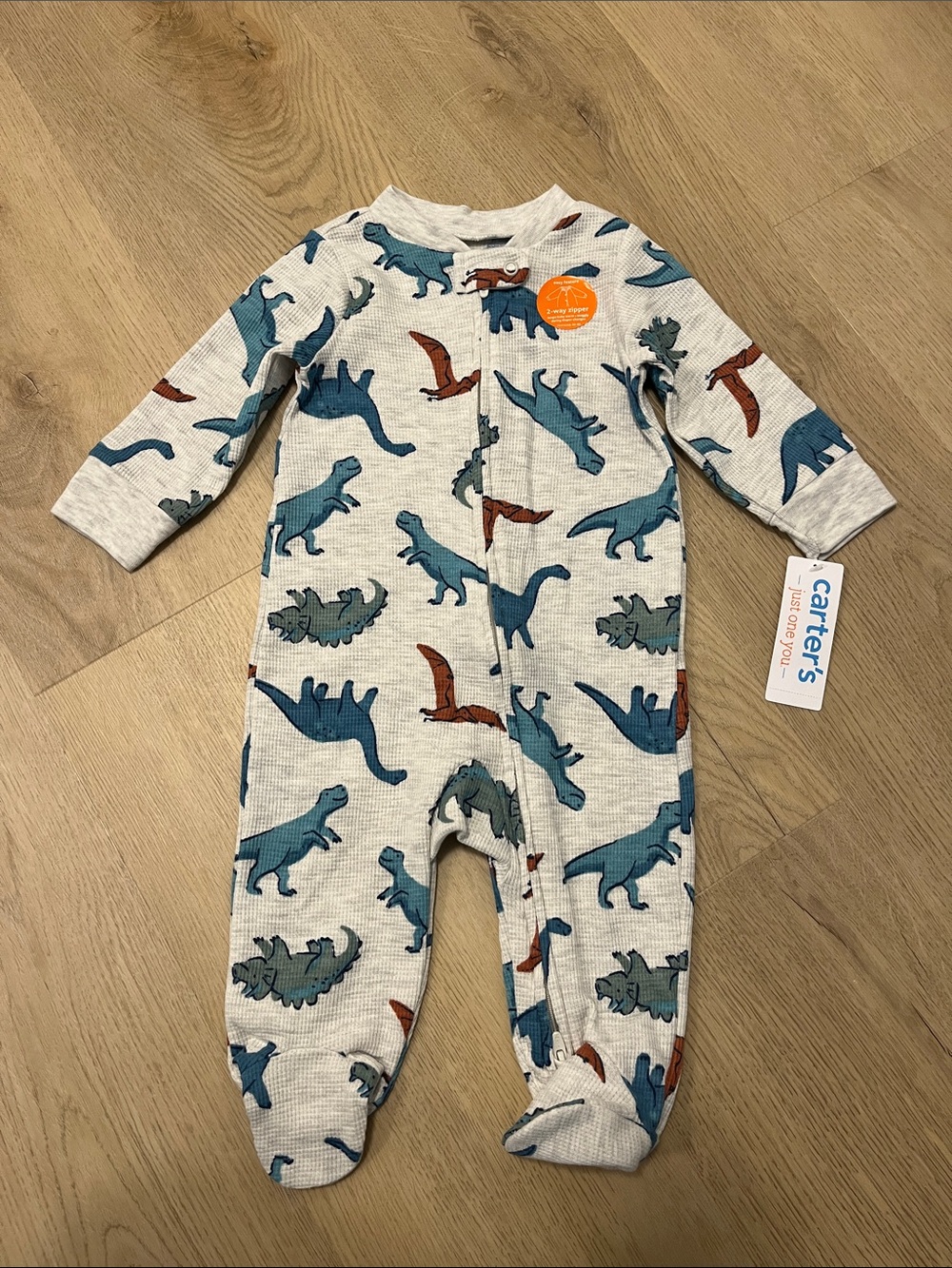 Carter's Cream One-Piece Footie with Blue and Brown Dinosaurs